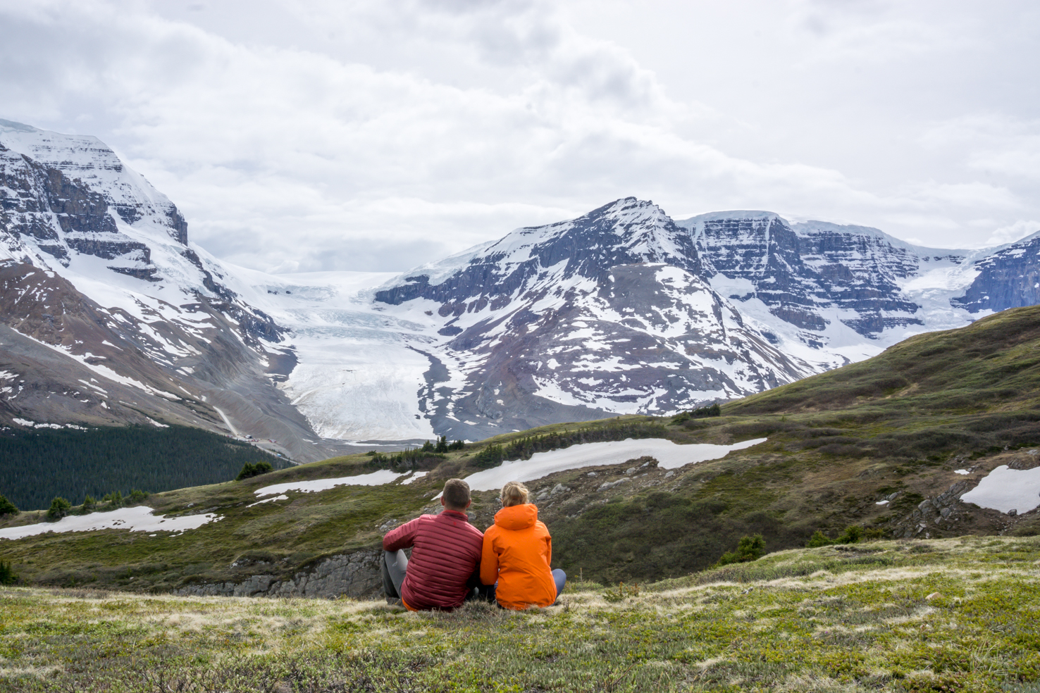 people sitting on a mountain