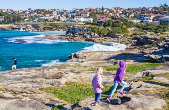 girls on a hillside by the beach in sydney