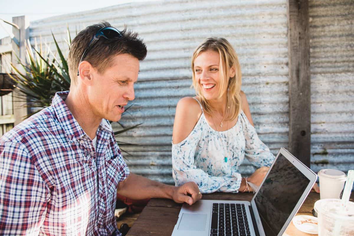 caroline and craig at computer laughing