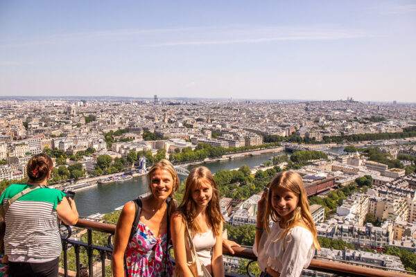 Mom and two daughters at the top of the Eiffel Tower