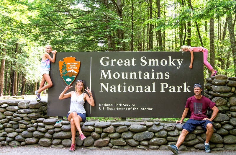 north-carolina-mountains family posing in front of great smoky mountains national park sign