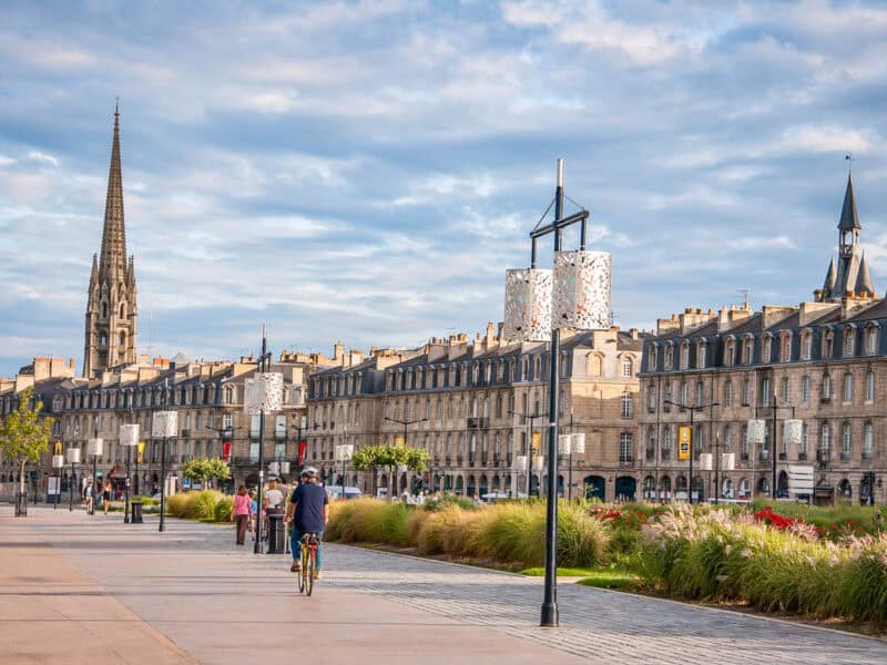 bikes riding along the quay of the garonne in bordeaux