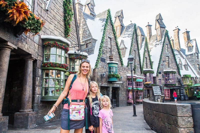 wizarding-world-of-harry-potter-islands-of-adventure-universal-orlando-resort (3) woman and two girls smiling in Hogsmeade Village at Universal Orlando Resort