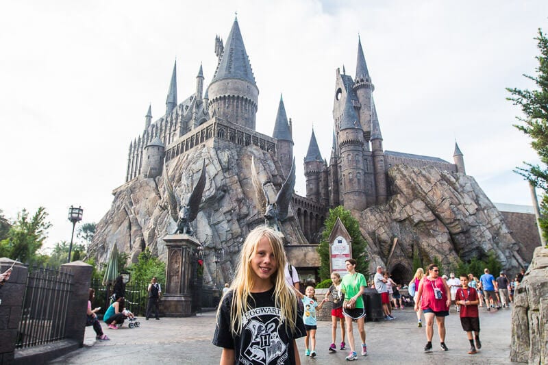 girl standing out front of hogwarts castle